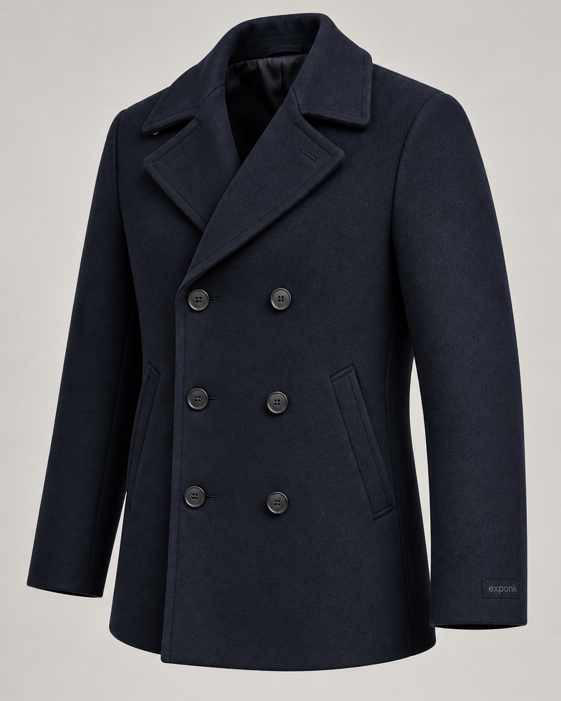 exponk Harbor Peacoat in navy, three-quarter view showing wide lapels, double-breasted buttons and side pockets.