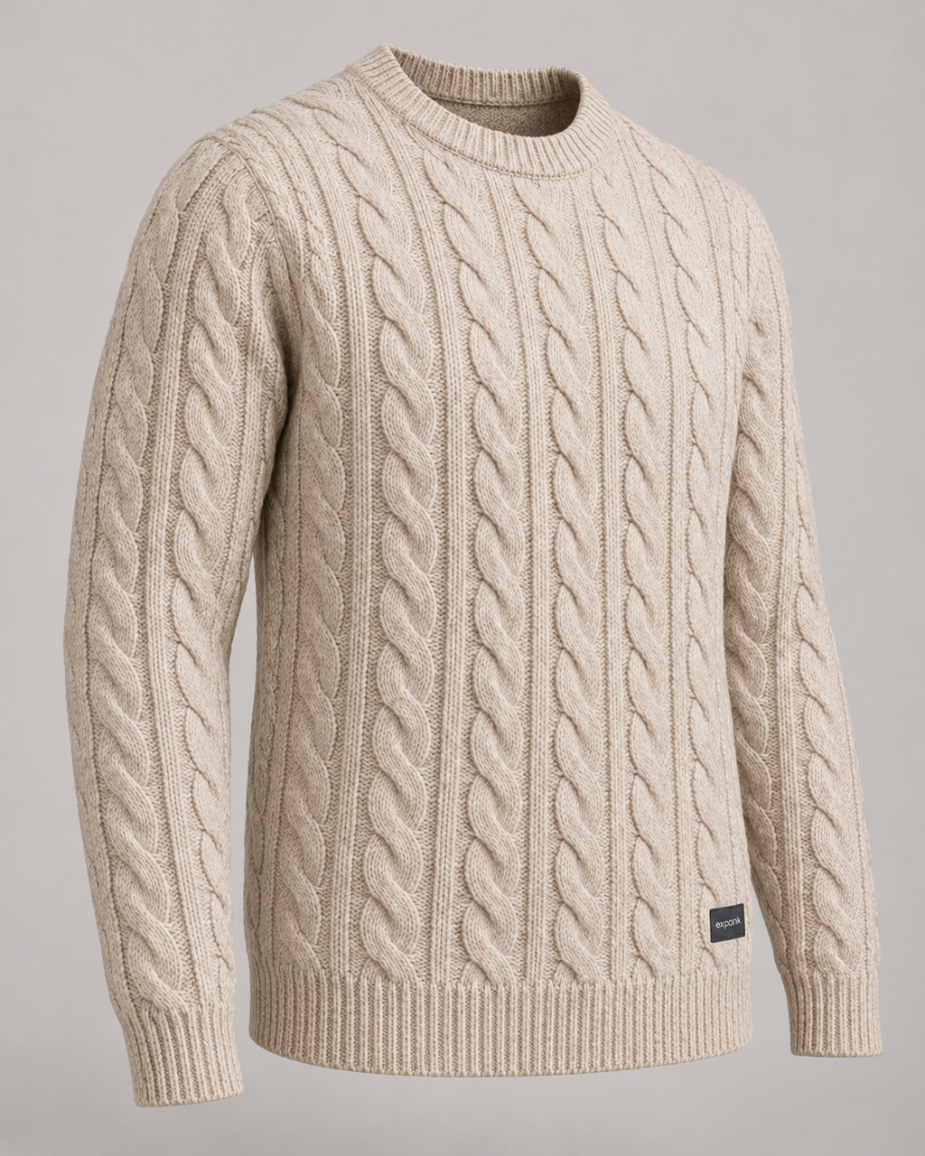 exponk Alpine Cable Knit Sweater in oatmeal, three-quarter view highlighting the cable knit texture and ribbed cuffs.