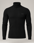 exponk Fjord Ribbed Turtleneck in black, front view with a fold-over high neck, vertical ribbing and discreet chest logo.