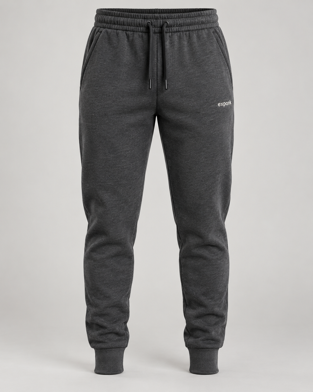 exponk Traverse Winter Joggers in charcoal, front view with a drawstring waistband, tapered legs, cuffed hems and thigh logo.