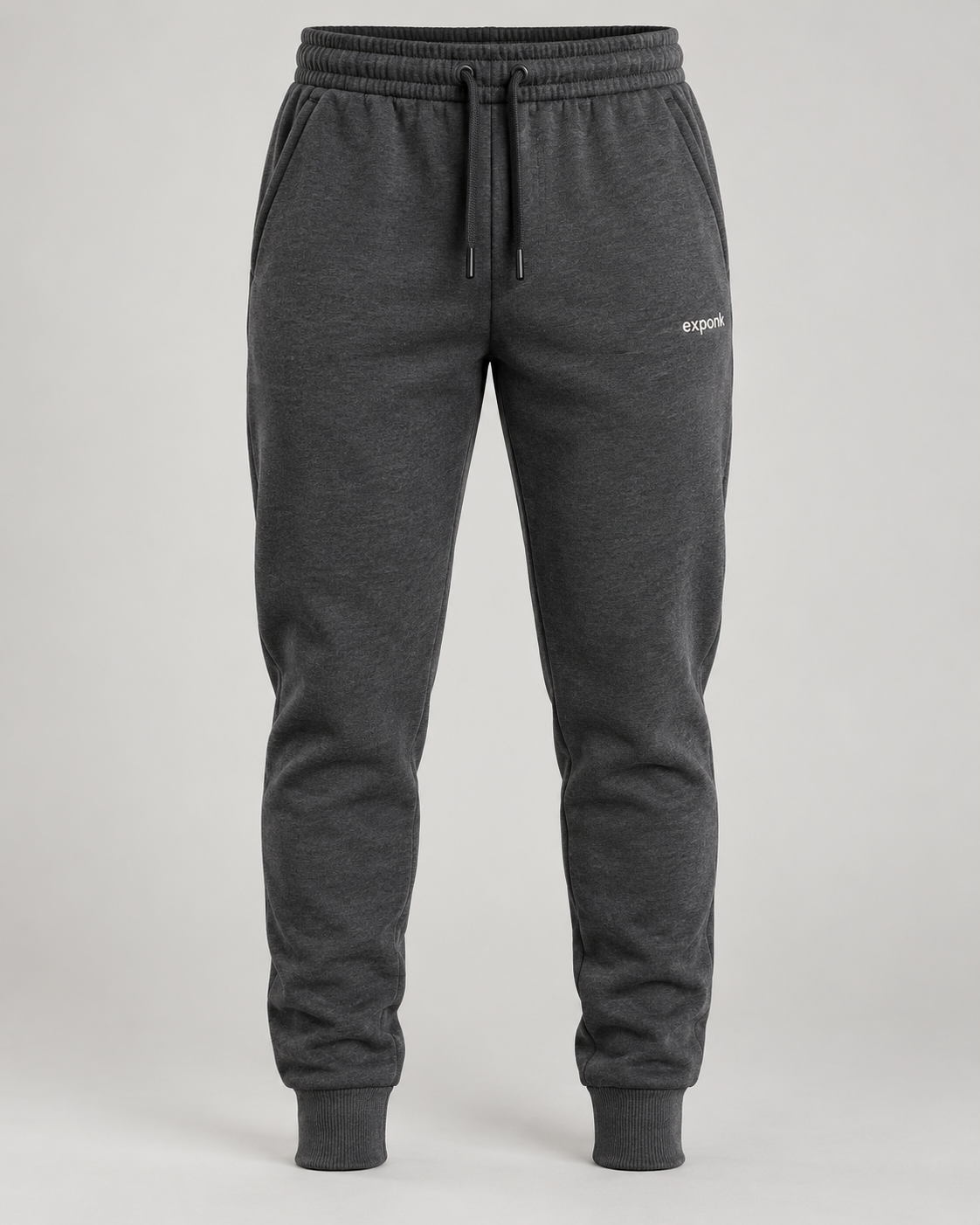 exponk Traverse Winter Joggers in charcoal, front view with a drawstring waistband, tapered legs, cuffed hems and thigh logo.